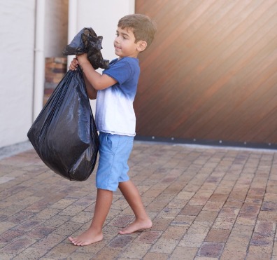 Boy Taking Out Trash | Better Beach Rentals