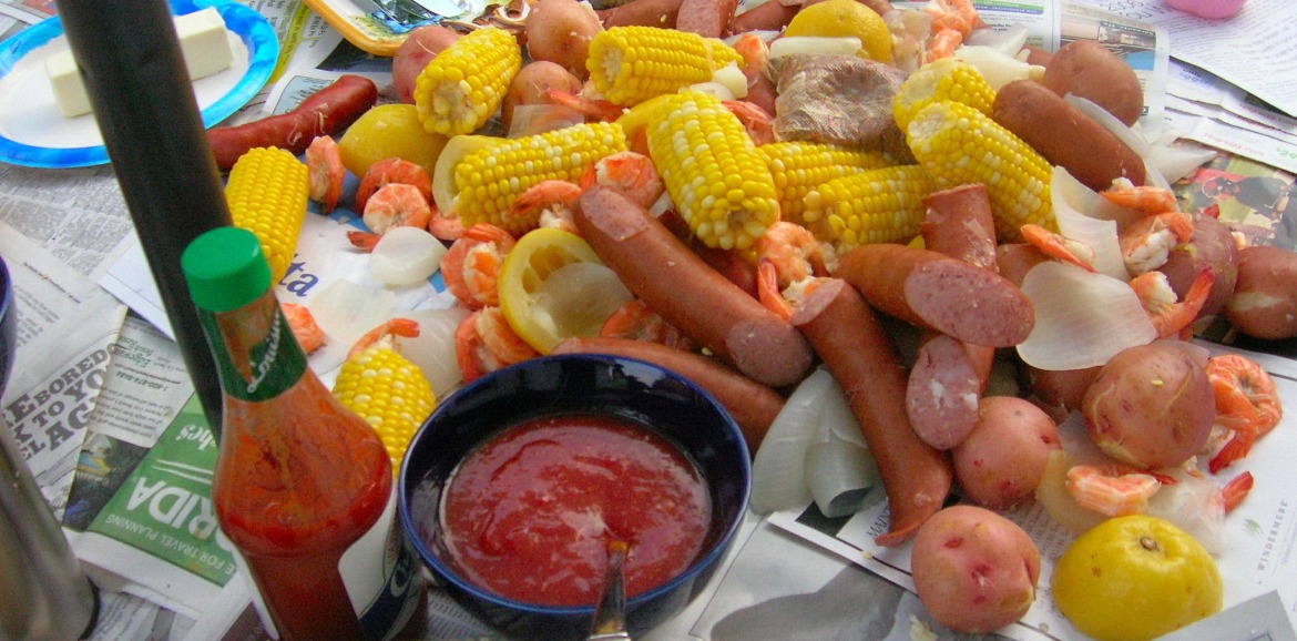 Country Boil on Newspaper and Table | Better Beach Rentals