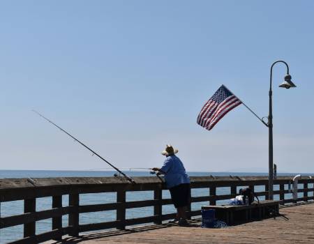 Man fishing on pier