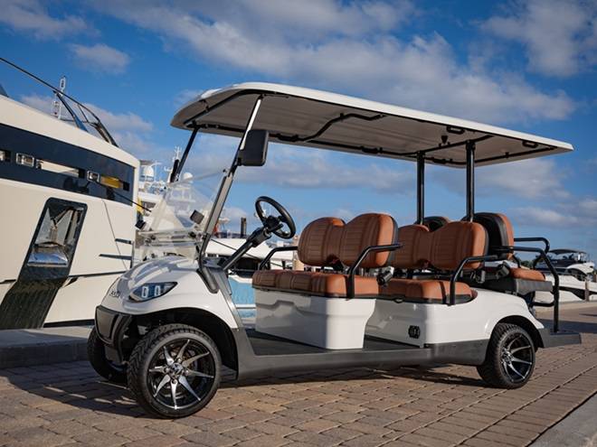 A six seater golf cart on the pier
