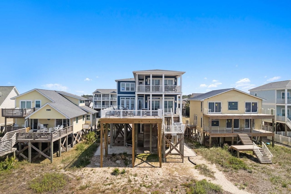 Beach house exterior with furnished deck space