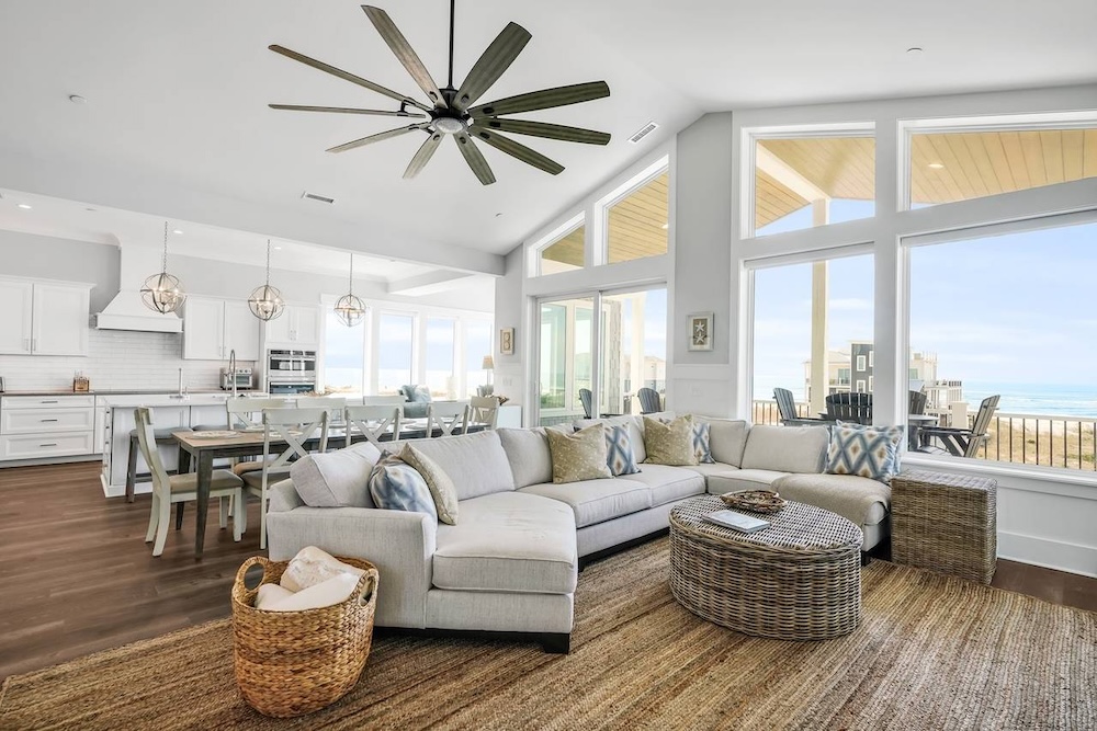 Vacation rental interior with deck and ocean view in background