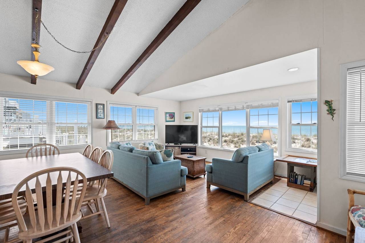 Vacation rental home interior with large windows and ocean views