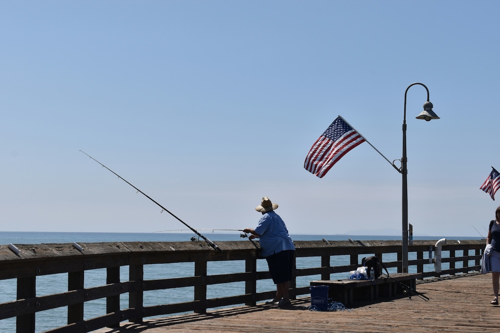 Man fishing on pier