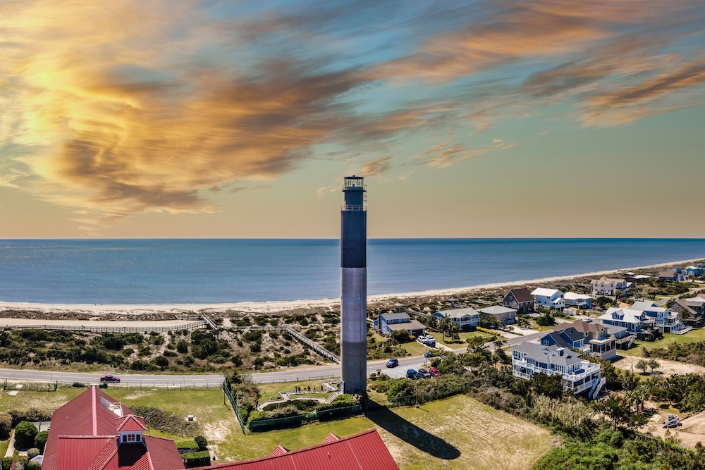 Oak Island Lighthouse with coastline in background