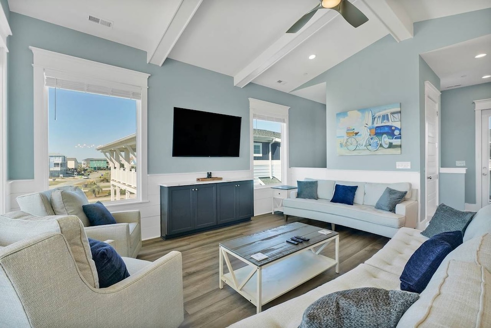 Vibrant beach home interior with large flat-screen TV