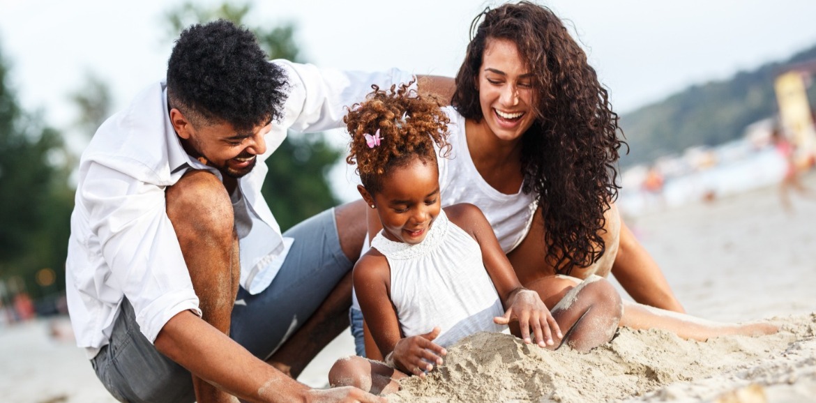 family playing on the beach | Better Beach Rentals